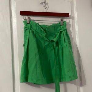 green skirt with belt and pockets